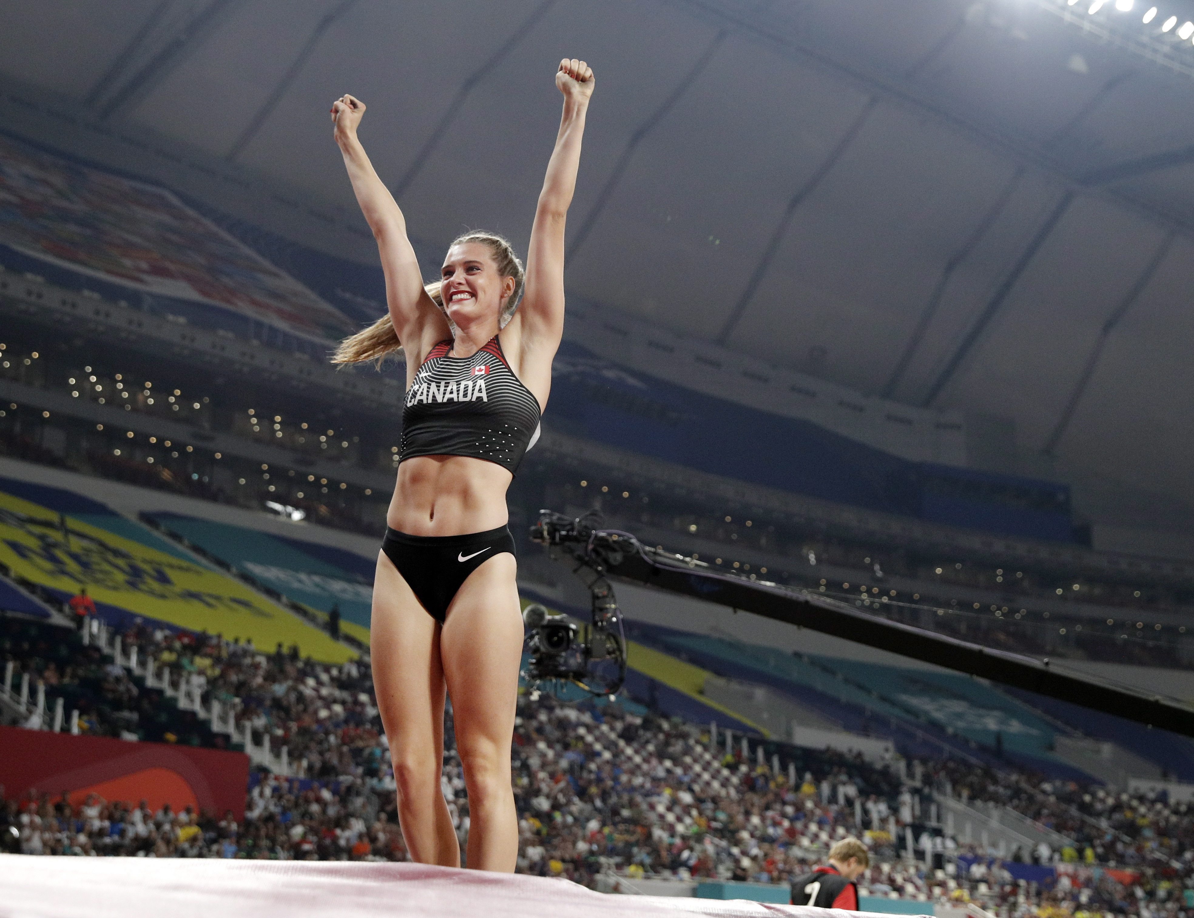Alysha Newman cheers after her pole vault in Doha.