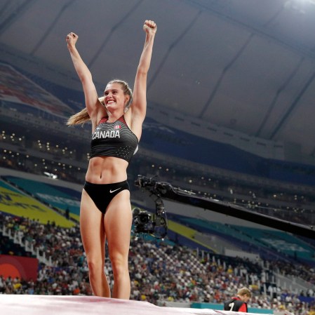 Alysha Newman cheers after her pole vault in Doha.