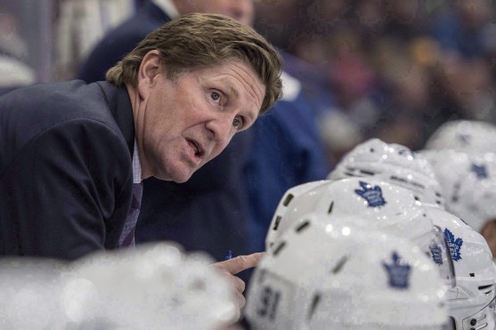 Mike Babcock speaks to his players