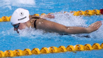 Canada's Penny Oleksiak swims to a second place finish in her semifinal for the women's 11m butterfly during swimming finals at the Commonwealth Games