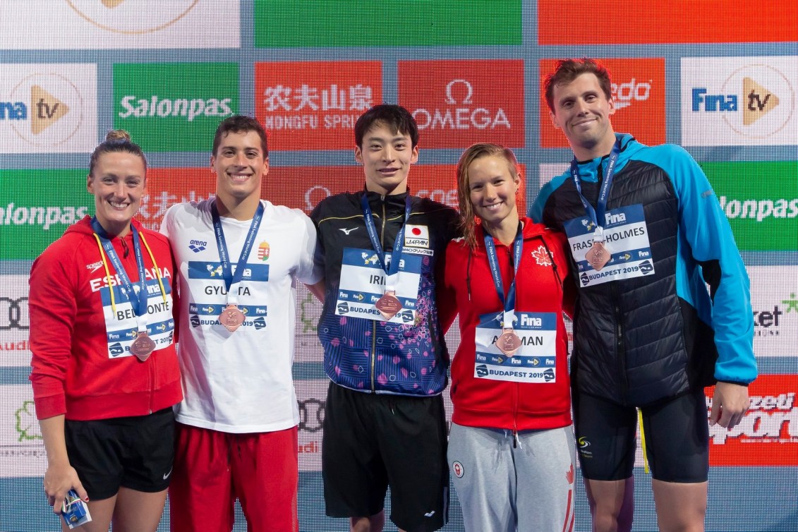 Aly Ackman (second from right) poses with other bronze medallists.