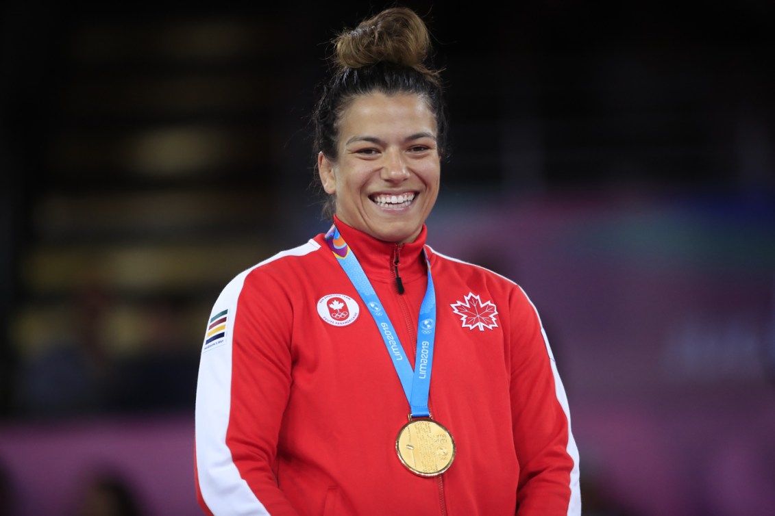 Justina Di Stasio wearing her gold medal.