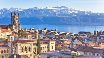 Scenic view of the city of Lausanne, with mountains in background.