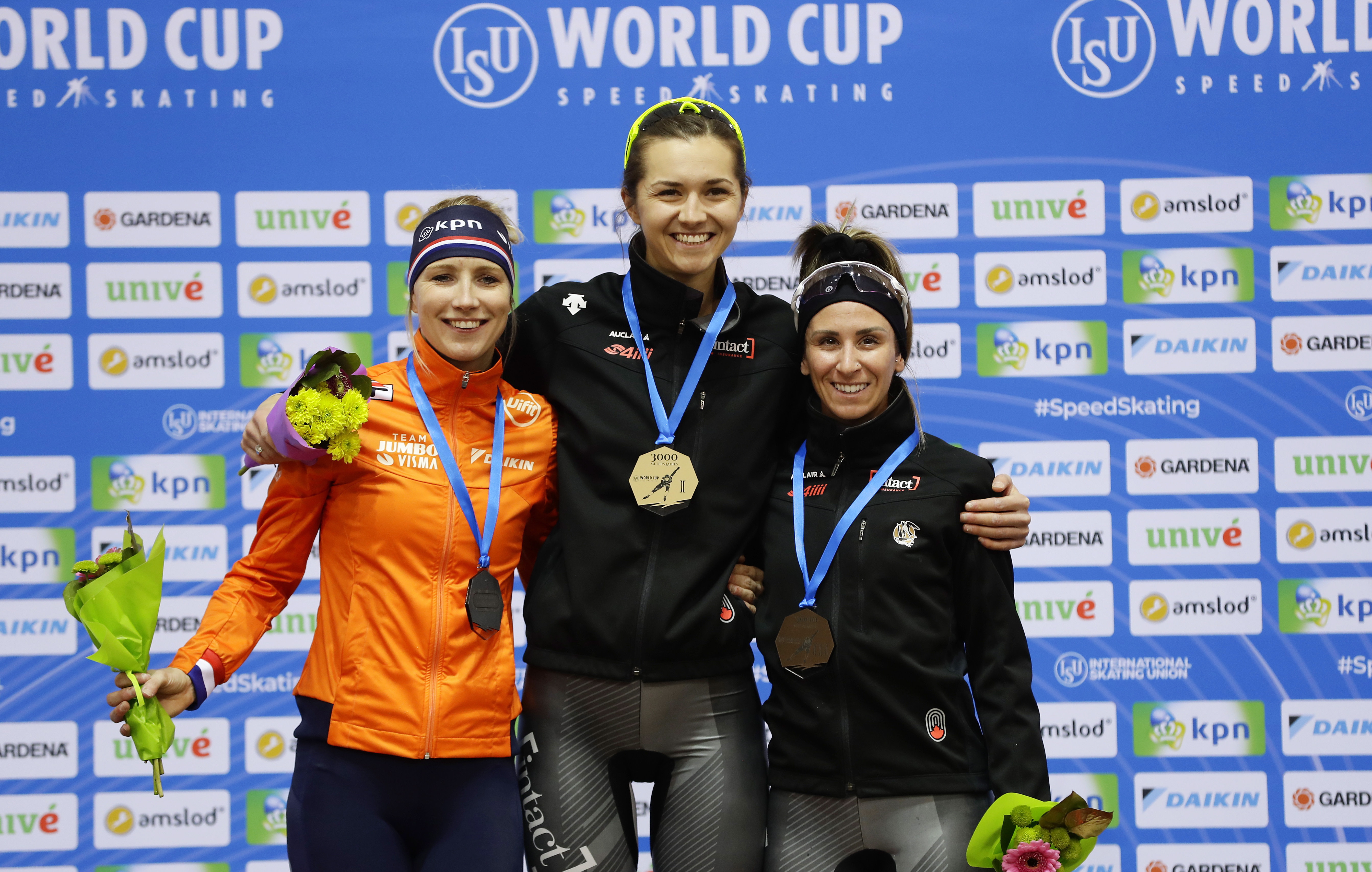 Speed skating medal winners on podium