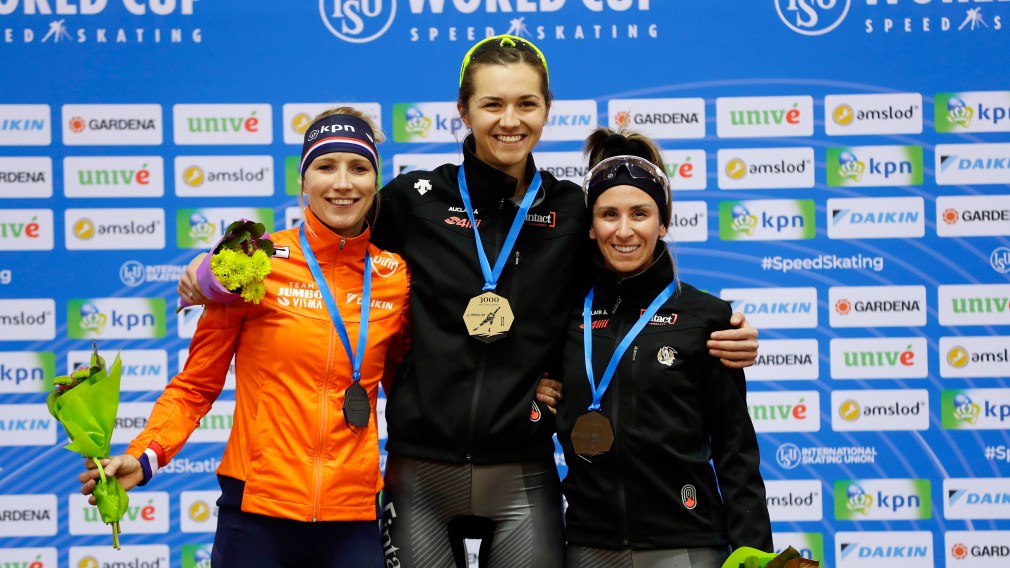Speed skating medal winners on podium