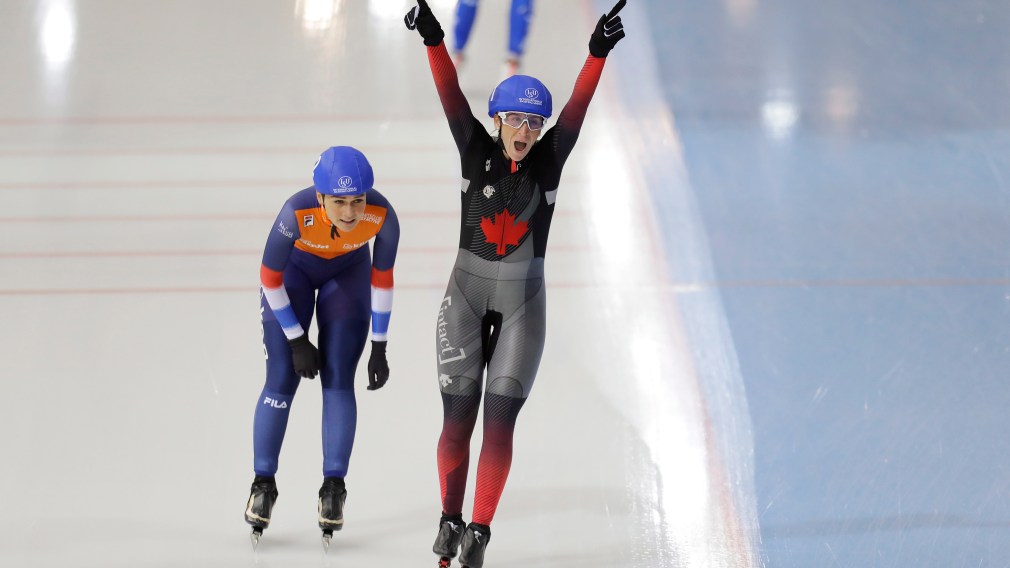 Canada's Ivanie Blondin, bottom right, celebrates after winning the women's mass start race as she followed by second placed Irene Schouten, of the Netherlands, during the speed skating World Cup at the Minsk ice arena in Minsk, Belarus, Sunday, Nov. 17, 2019. (AP Photo/Sergei Grits)