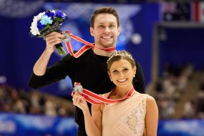 Silver medalists Kirsten Moore-Towers and Michael Marinaro of Canada pose with their medals at a victory ceremony for the pairs free skating program during the ISU Grand Prix of Figure Skating