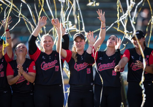 Softball team celebrating