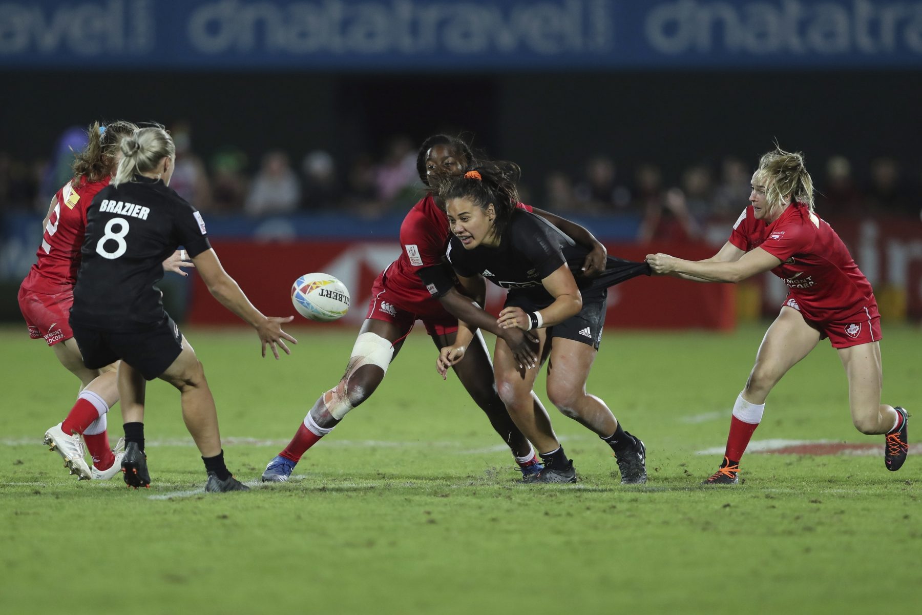 New Zealand's Shakira Baker passes the ball in the final match against Canada at the Emirates Airline Rugby Sevens in Dubai, United Arab Emirates, Saturday, Dec.7, 2019. (AP Photo/Kamran Jebreili)