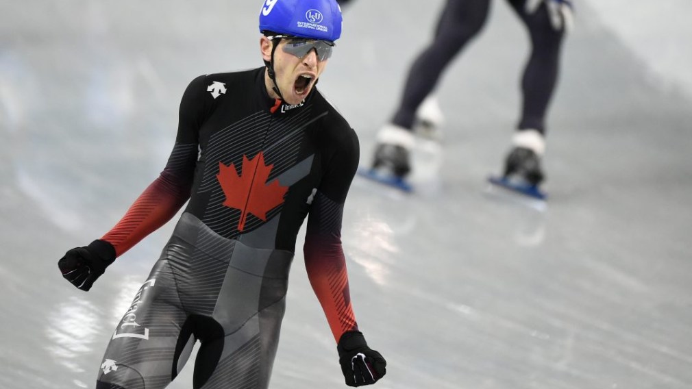 Canada's Jordan Belchos celebrates after winning gold at the ISU Speed Skating World Cup
