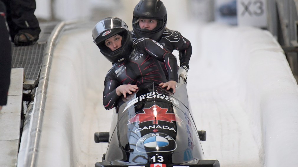 Driver Christine de Bruin, and brakeman Kristen Bujnowski of Canada, finish third place in the women's bobsled World Cup race, in Lake Placid, N.Y., on Saturday, Dec. 14, 2019. (AP Photo/Hans Pennink)