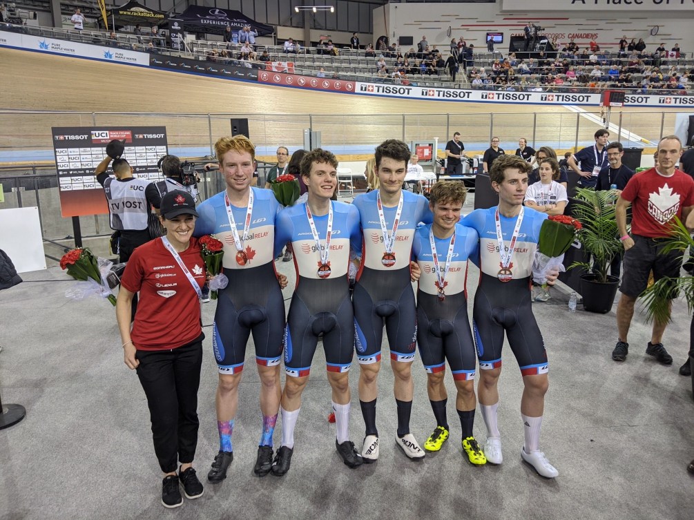 The men's team pursuit group poses for a group medal after receiving their bronze medals.