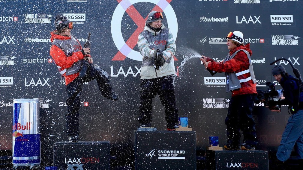 The men's snowboard slopestyle podium celebrates at the 2020 Laax Open World Cup.