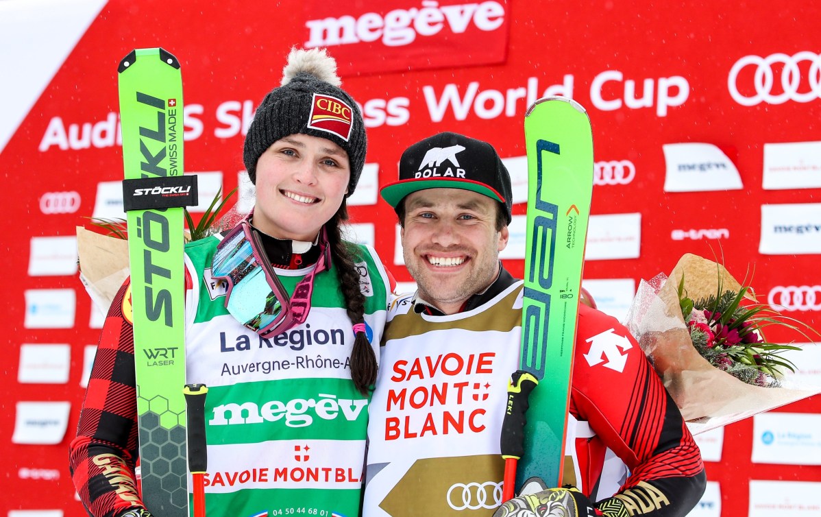 Marielle Thompson and Kevin Drury celebrate double gold medals in Megeve, France during Ski Cross World Cup on February 1, 2020.
