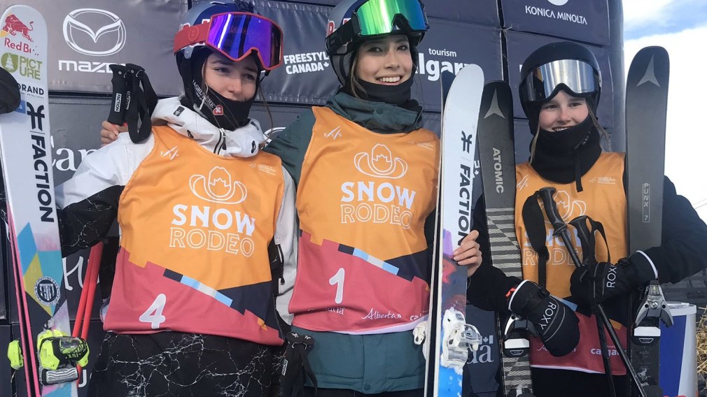 Slopestyle medallists stand on the podium after competing in the women's freestyle skiing event.