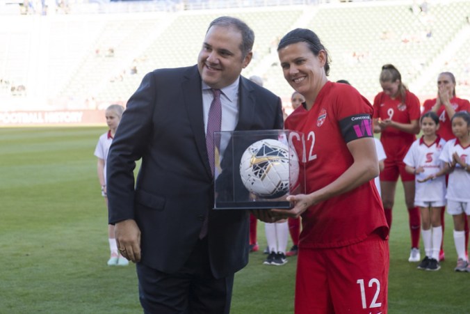 Team Canada Sinclair 2 Christine Sinclair is given her record-breaking game ball by Victor Montagliani