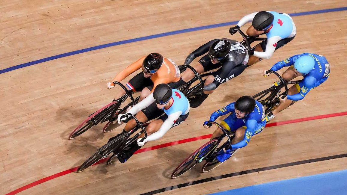 Canadian cyclists Kelsey Mitchell, front white gloves, and Lauriane Genest compete in the Women’s Keirin finals during the Tokyo 2020 Olympic Games on August 05, 2021.