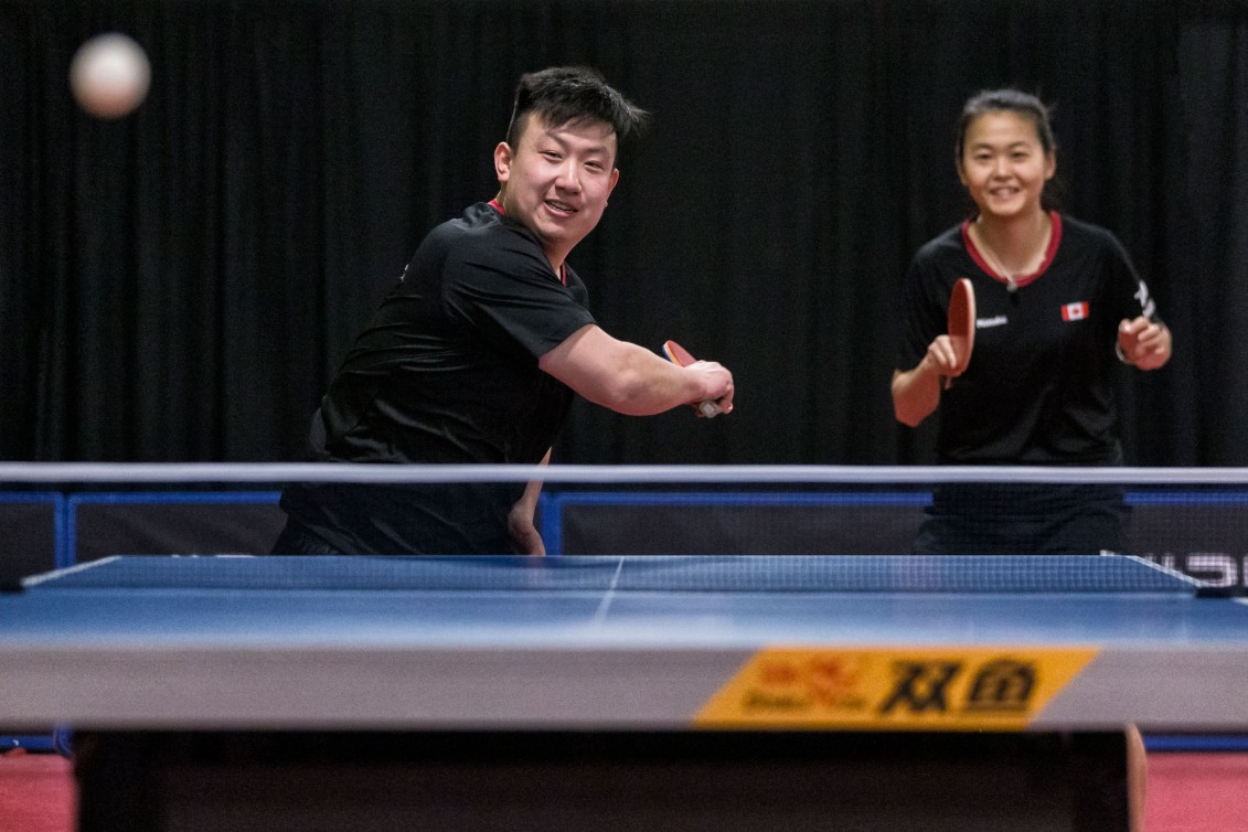 Eugene Wang (left) and Mo Zhang compete during the ITTF North American qualifier.