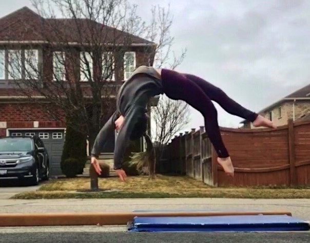 Ana Padurariu trains on a beam in front of her house 