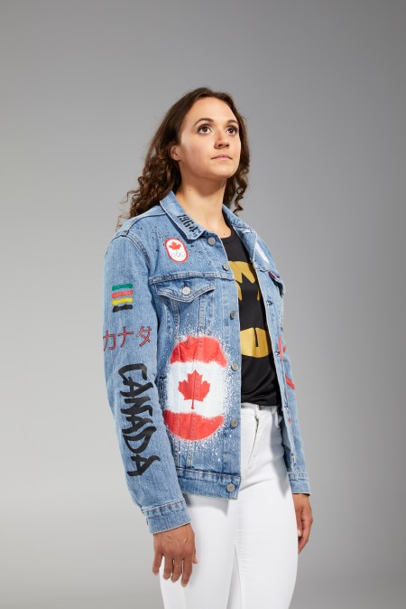 Kylie Masse is facing the camera in Tokyo 2020 closing ceremony jean jacket