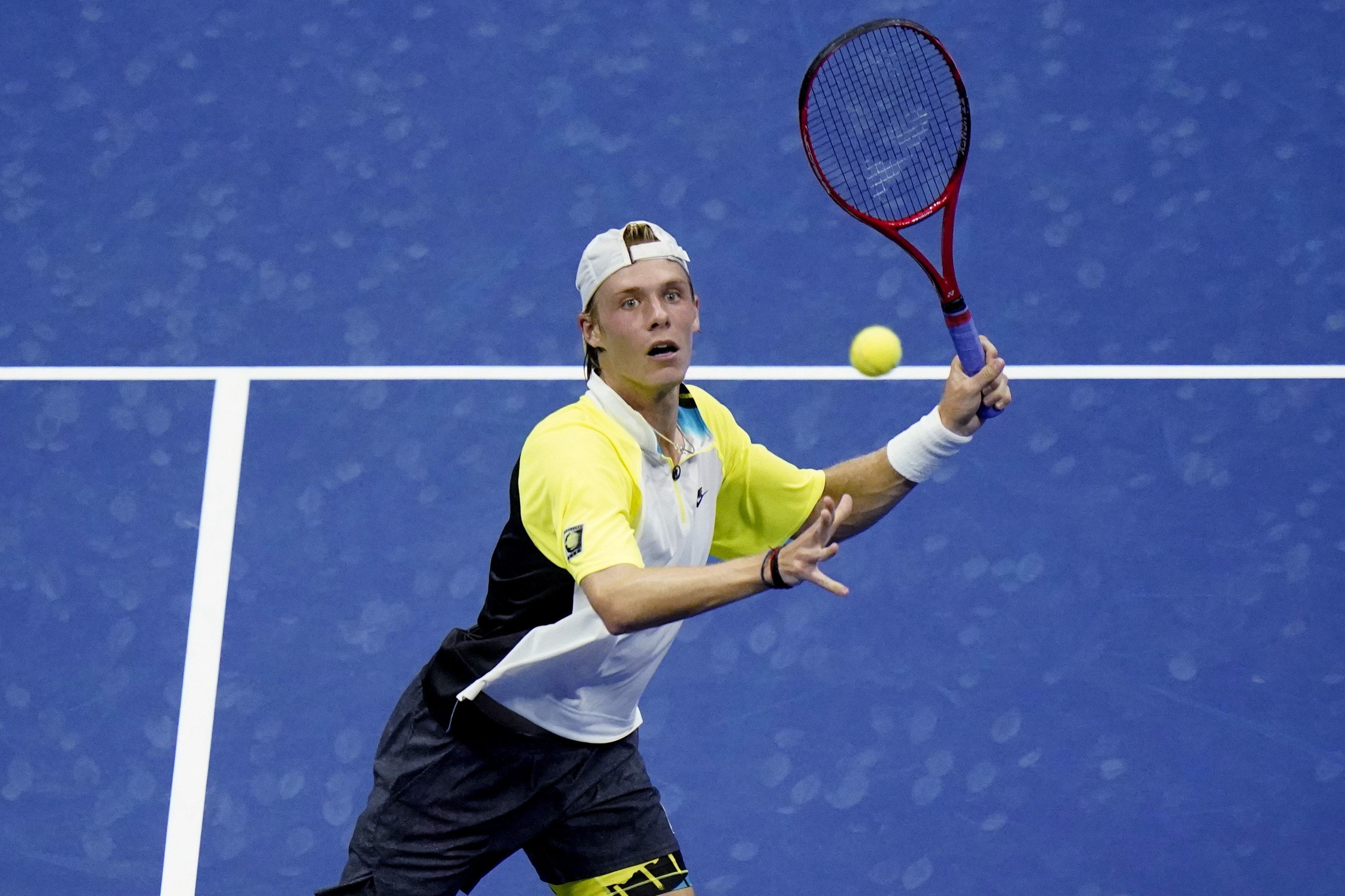 Denis Shapovalov, of Canada, eyes a return to Pablo Carreno Busta, of Spain, during the quarterfinal round of the US Open tennis championships, Tuesday, Sept. 8, 2020, in New York. (AP Photo/Frank Franklin II)