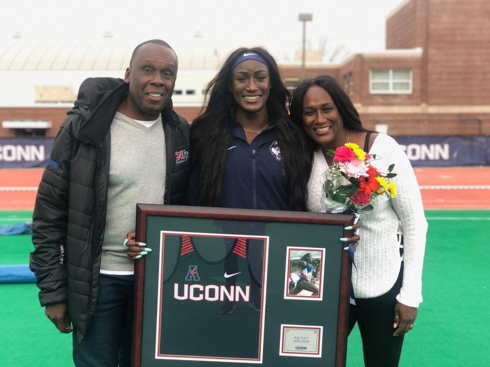 Bruny Surin poses with his daughter Katherine and his wife