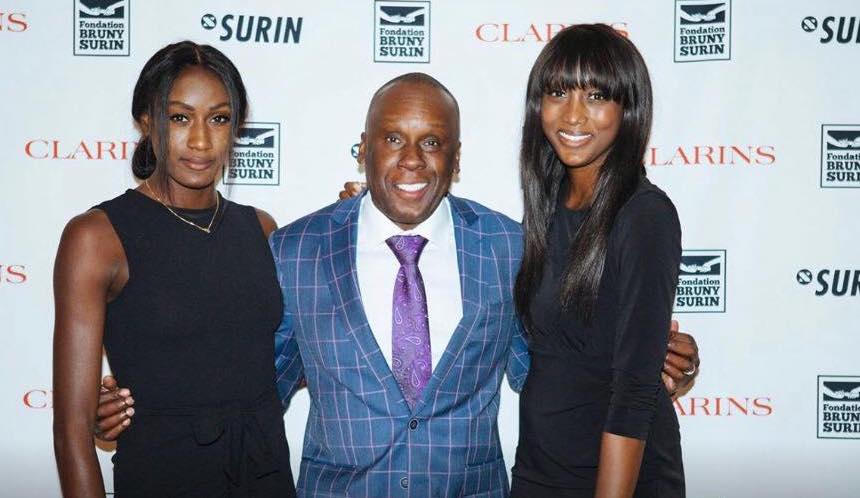 Bruny Surin poses with his two daughters