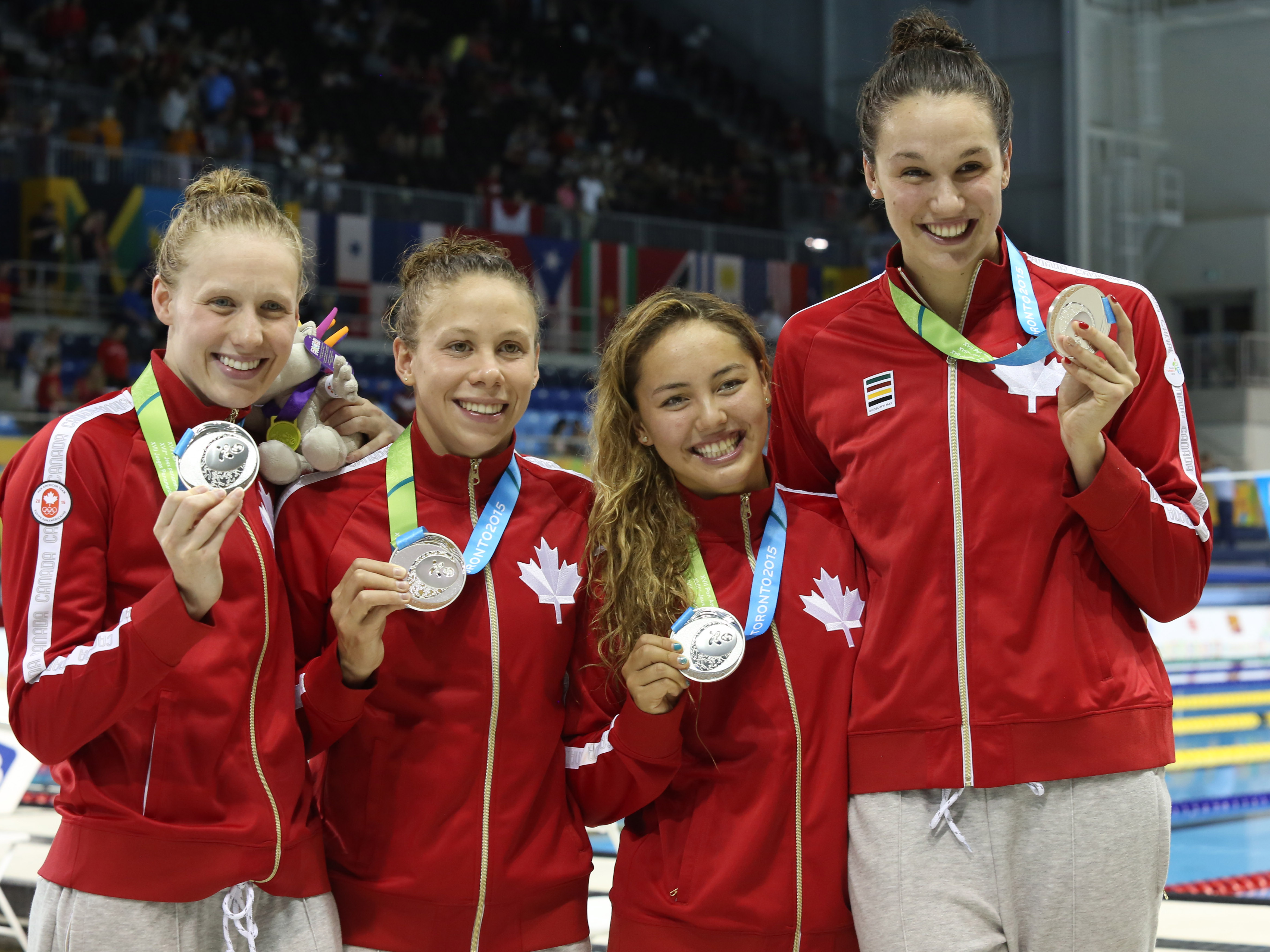 Noemie Thomas and Team Canada celebrate a silver medal 