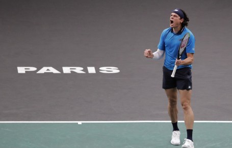 Milos Raonic celebrates victory in the quartefinals at the Paris Masters