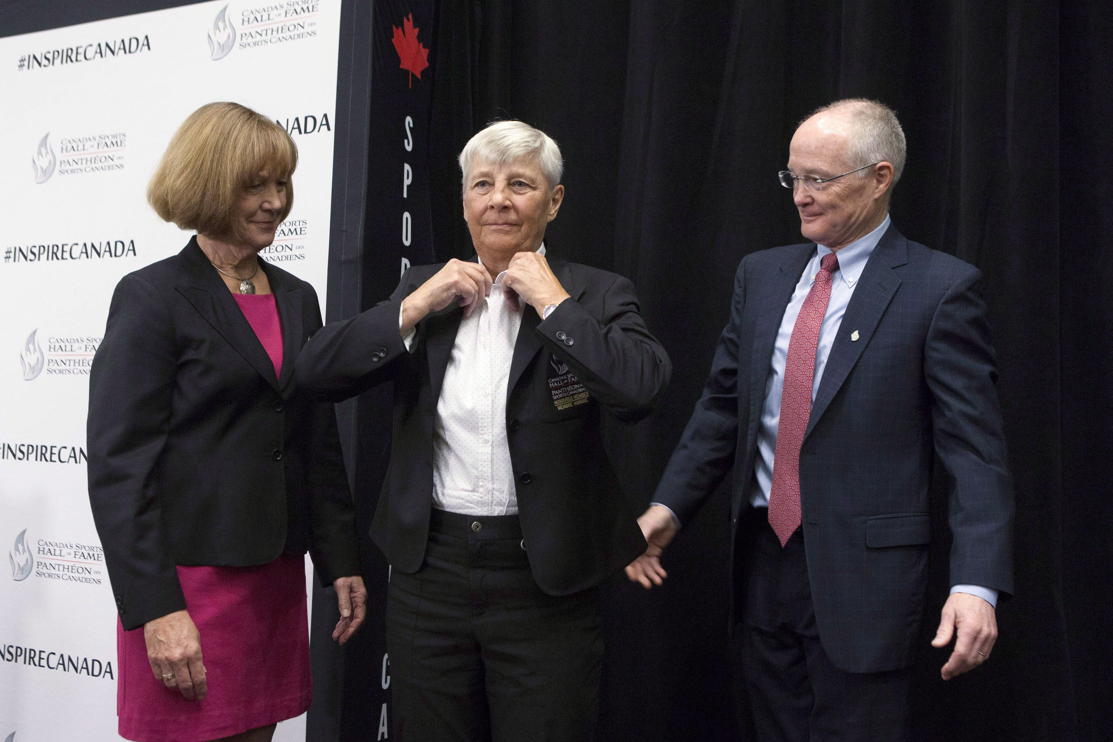 Sandra Kirby adjusts her blazer upon induction to Canada's Sports Hall of Fame