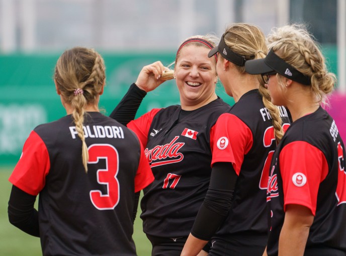Team Canada softball Lima 2019 Members of women's softball team talking in a huddle
