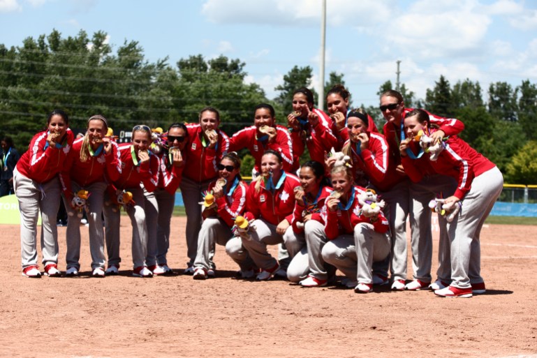 Team Canada softball Toronto 2015 The womens softball team bites their medals