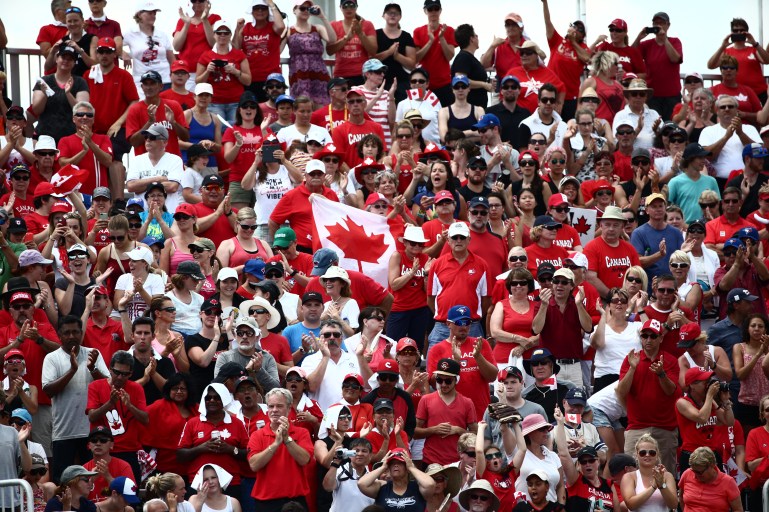 Team Canada fans watch softball