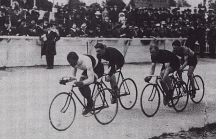 Black and white image of Marshall "Major" Taylor racing in Paris in 1908.