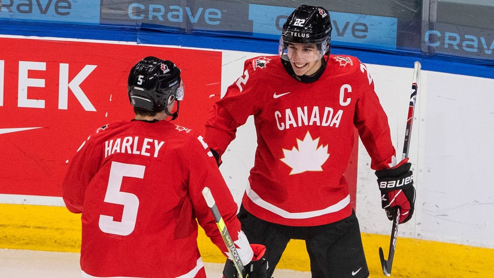 Canada's Thomas Harley (5) and Dylan Cozens (22) celebrate a goal during first period IIHF World Junior Hockey Championship action against Finland, in Edmonton, Thursday, Dec. 31, 2020. THE CANADIAN PRESS/Jason Franson