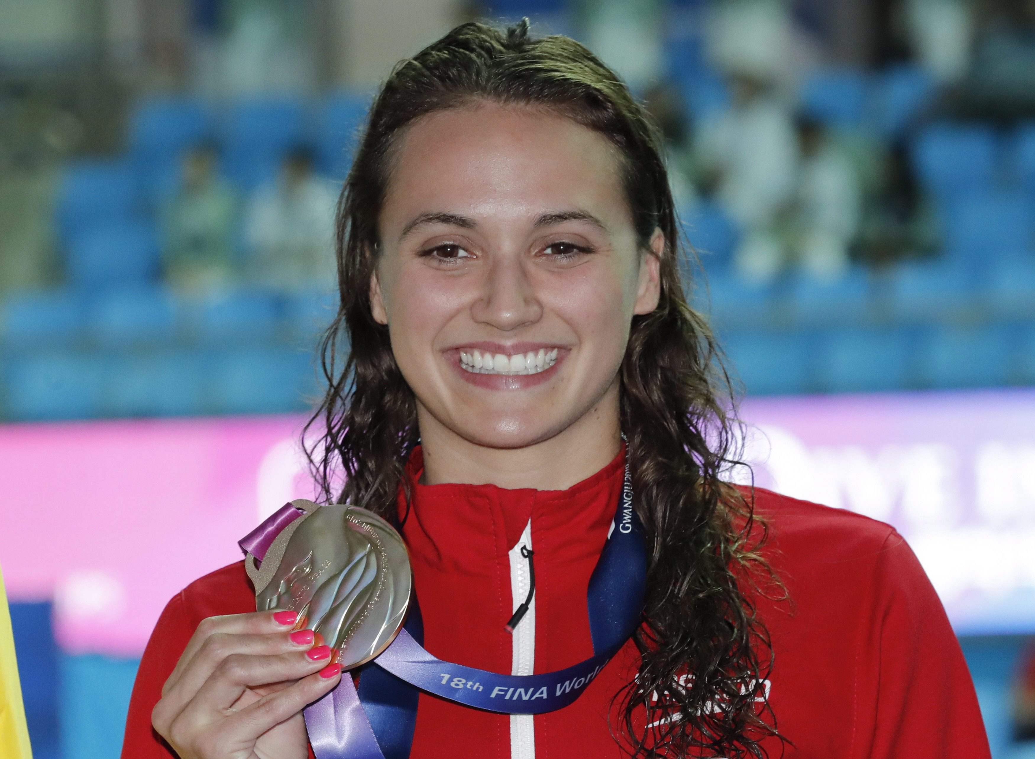 Kylie Masse holds gold medal 