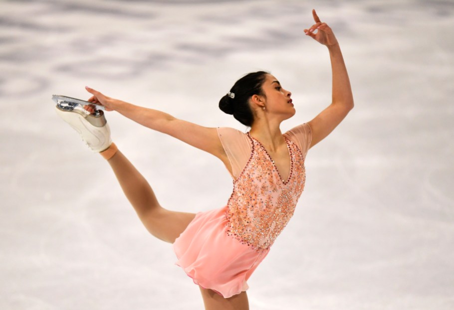 Madeline Schizas Figure skater performs an arabesque