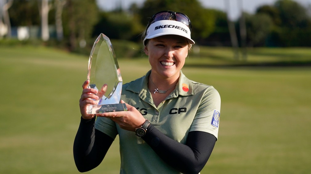 Brooke M. Henderson poses with her trophy after winning the LPGA's Hugel-Air Premia LA Open golf tournament at Wilshire Country Club Saturday, April 24, 2021, in Los Angeles.