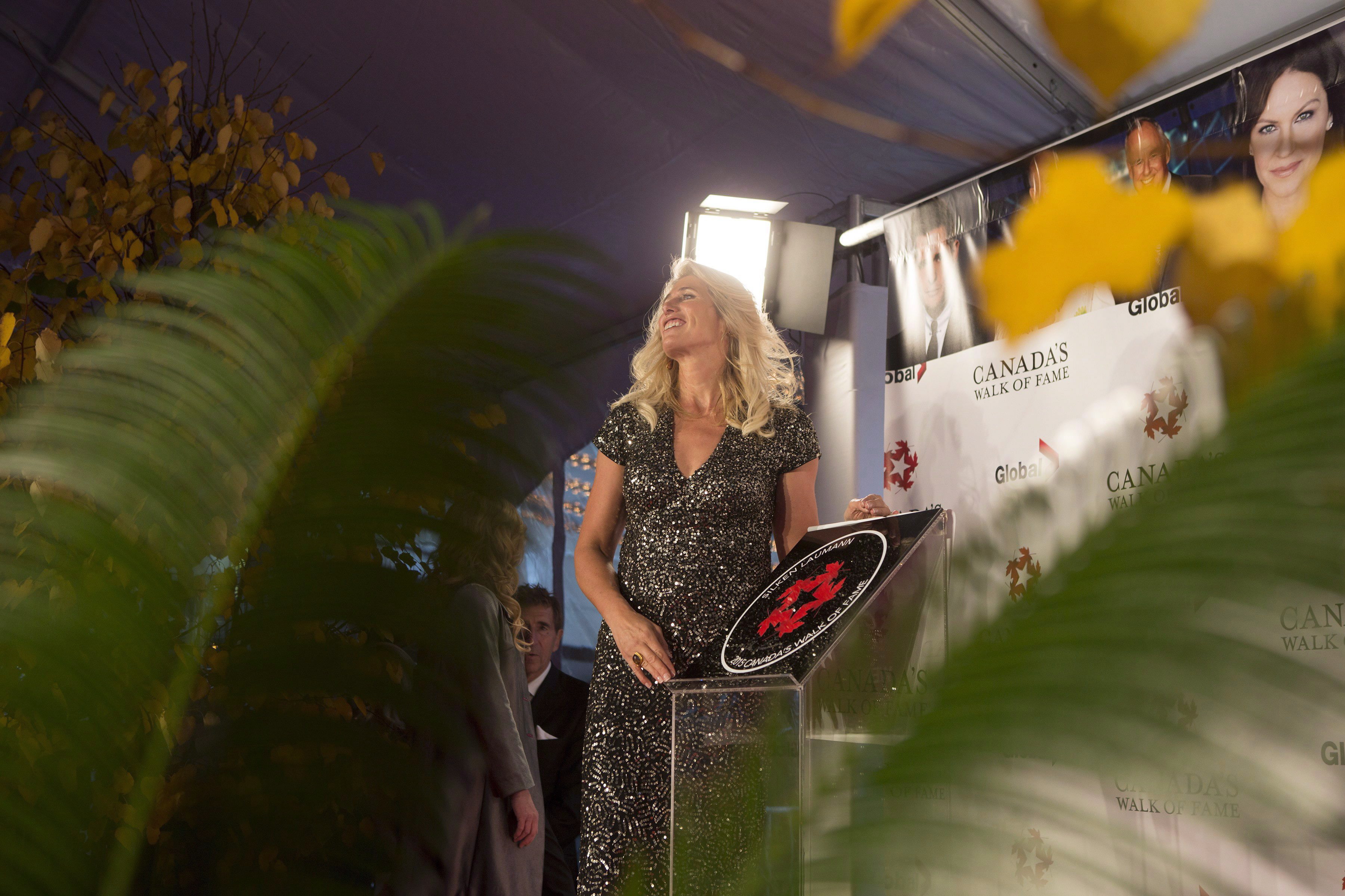 Silken Laumann poses for photographs with her plaque as she is inducted into Canada's Walk of Fame during an event in Toronto on Saturday, November 7, 2015.