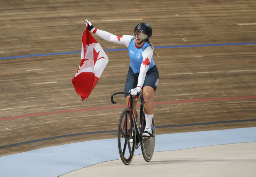 Kelsey Mitchell celebrates with a Canadian flag