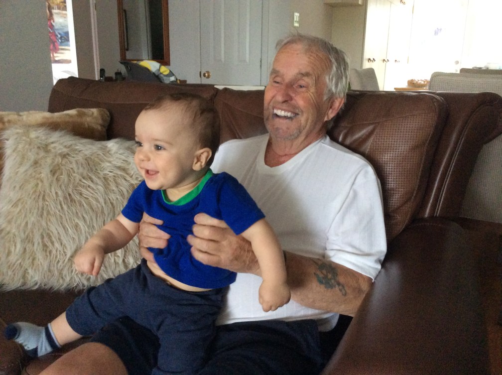 Annie Pelletier's father holds his baby grandson 