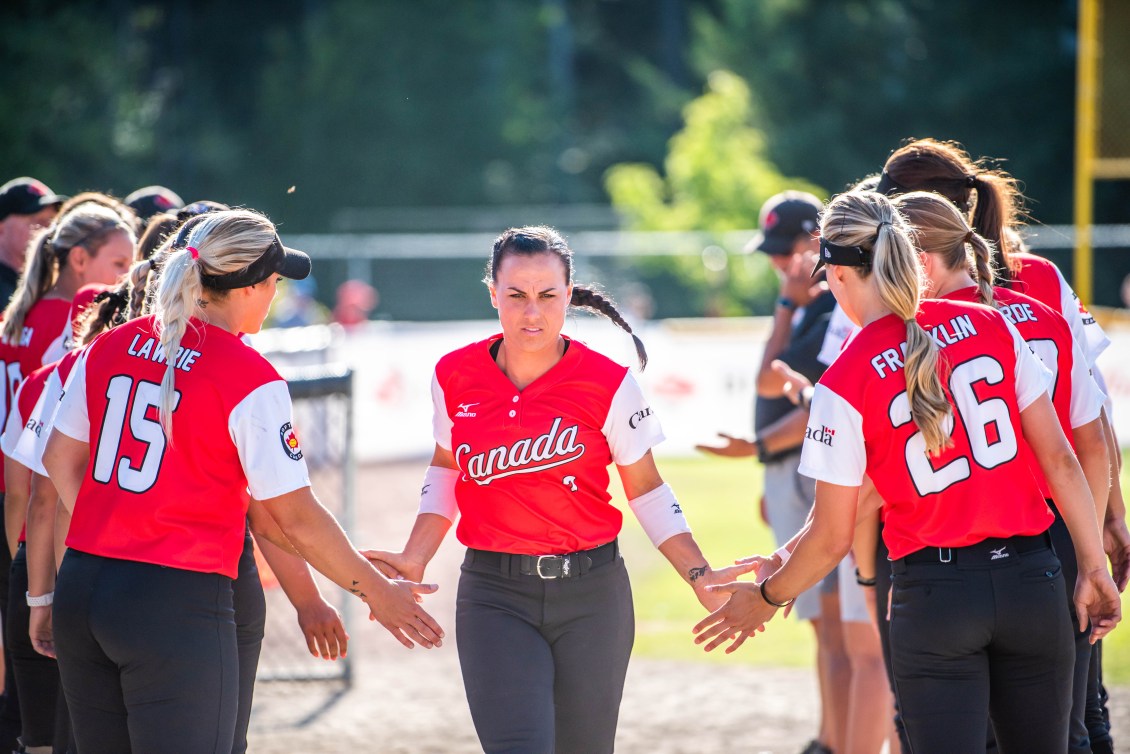 Jennifer Salling clapping hands of teammates