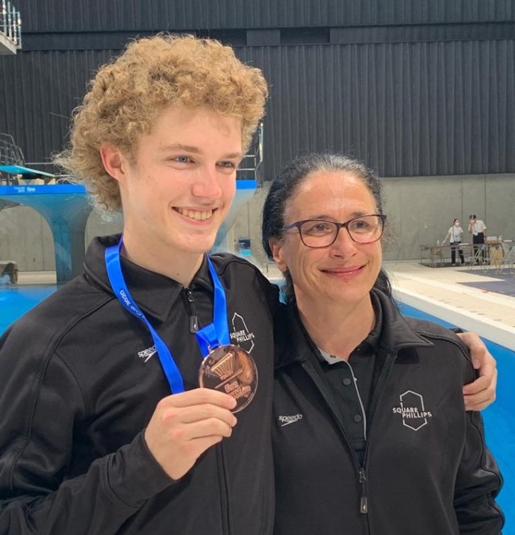 Rylan Wiens poses with bronze medal