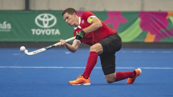 Scott Tupper of Canada plays the ball against the United States in field hockey at the Lima Pan American Games on Aug. 1, 2019. THE CANADIAN PRESS/HO-COC, Andrew Lahodynskyj,