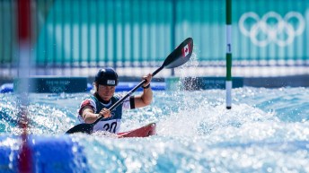 Florence Maheu paddles her kayak through a whitewater slalom course