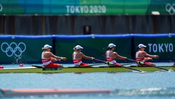 Women's four rowing boat in a race