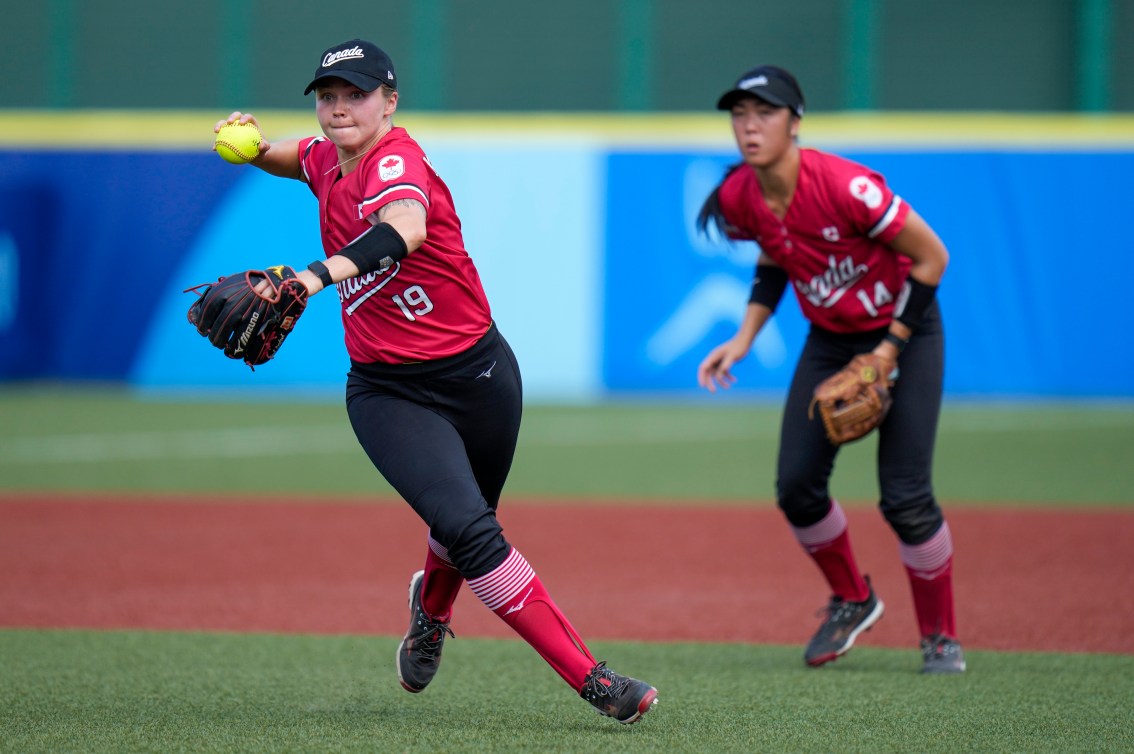 Canada's Emma Entzminger makes a throw against Mexico during Tokyo 2020 softball tournament