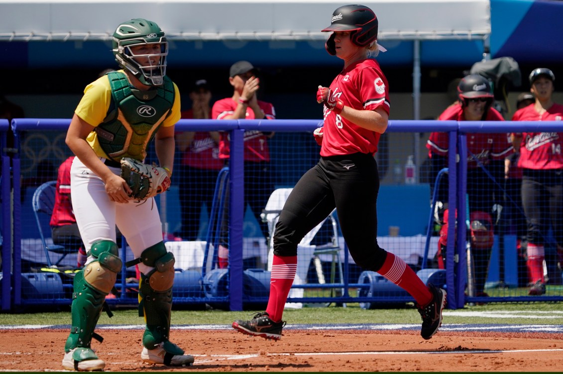 Victoria Hayward crosses home plate