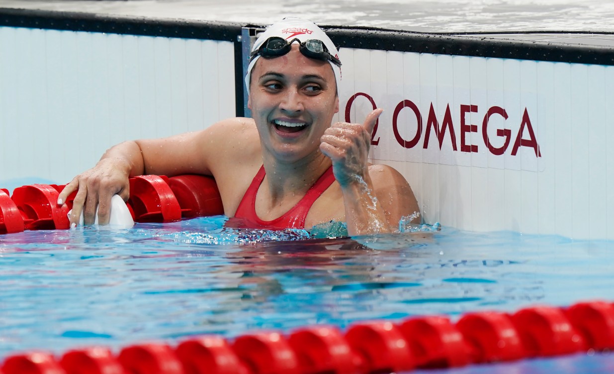 Kylie Masse in the pool celebrating her silver medal