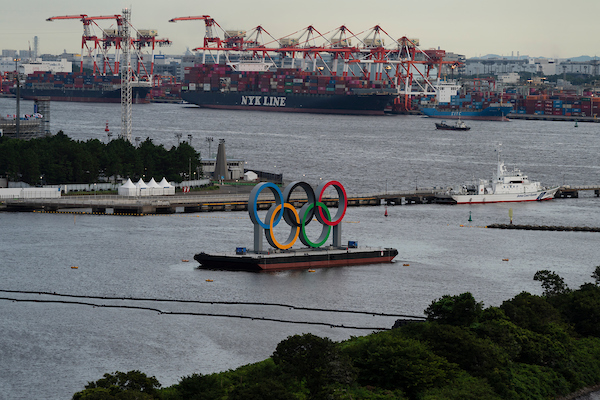 Waterfront of the city of Tokyo with the Olympic Rings floating in the harbour
